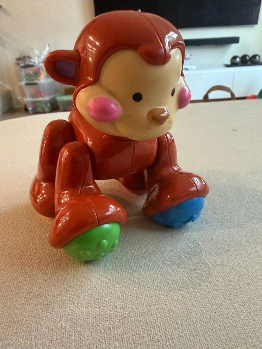 Fisher-Price Red Monkey Push Toy with Blue and Green Rollers